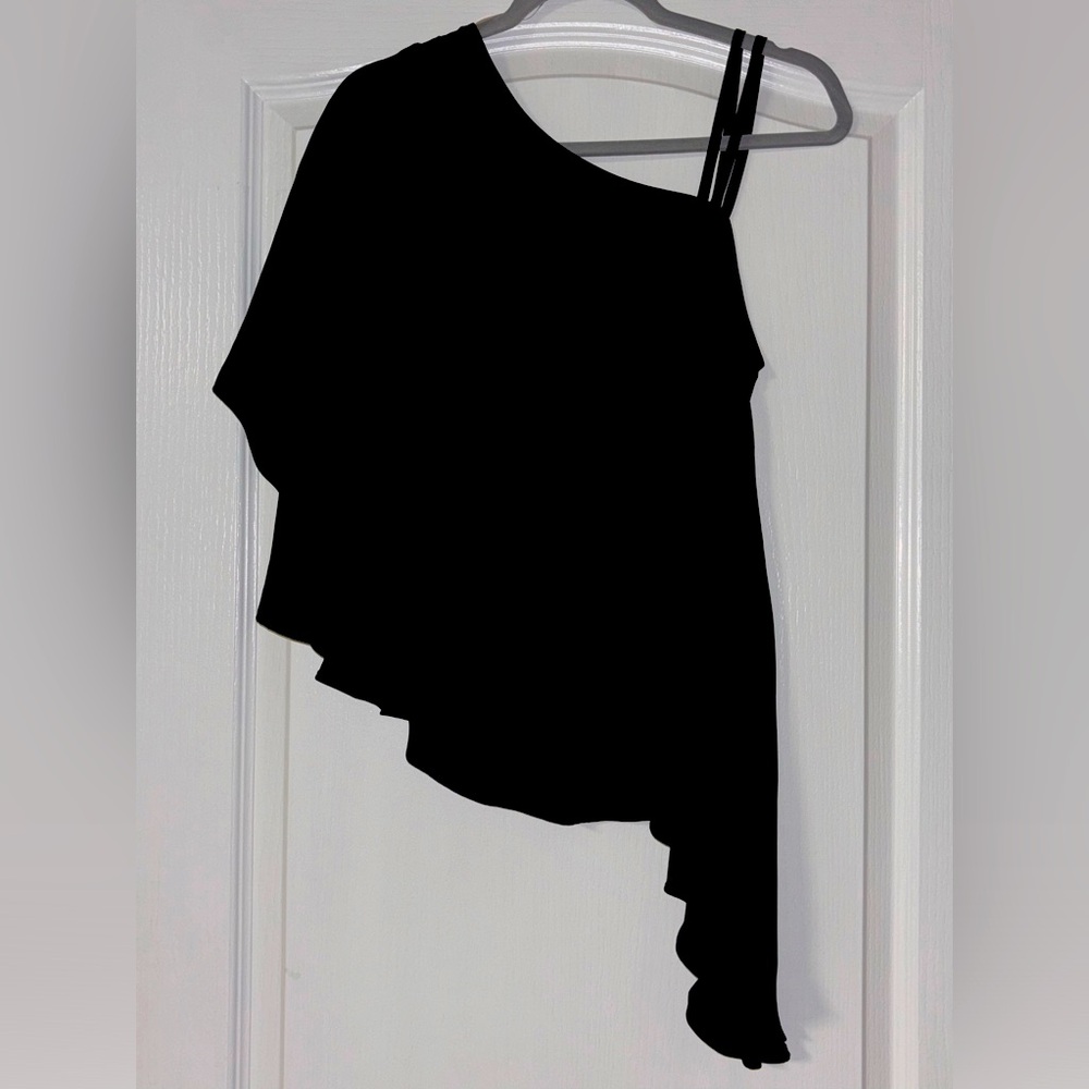 Bold elements asymmetrical top. No tags, never worn. Too big.
